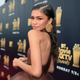 Zendaya, wearing August Getty Atelier, attends the 2018 MTV Movie & TV Awards at Barker Hangar on June 16, 2018, in Santa Monica, Calif.